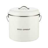 Seed & Sprout kitchen compost bin in mushroom white featuring a vented lid, side handles, and subtle brand logo.