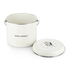 Seed & Sprout open kitchen compost bin in mushroom white with its vented charcoal-filter lid resting beside it.