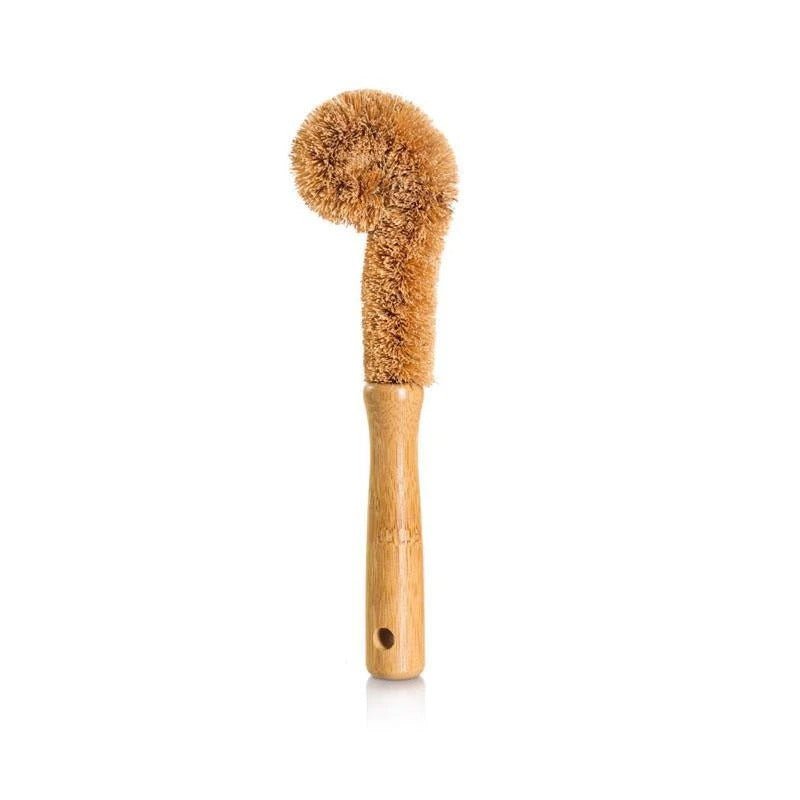 Seed & Sprout coconut fiber bottle brush standing vertically on a white background with a smooth wooden handle and hanging hole.