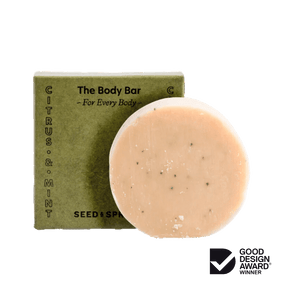 Seed & Sprout "The Body Bar" in Citrus & Mint placed in front of its matching olive green packaging box.