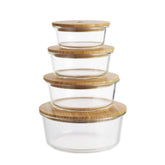 Seed & Sprout 4-piece Round Eco Stow glass food container set with bamboo lids stacked vertically.