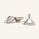 Seed & Sprout stainless steel funnel set of 3 displaying different sizes with engraved branding.