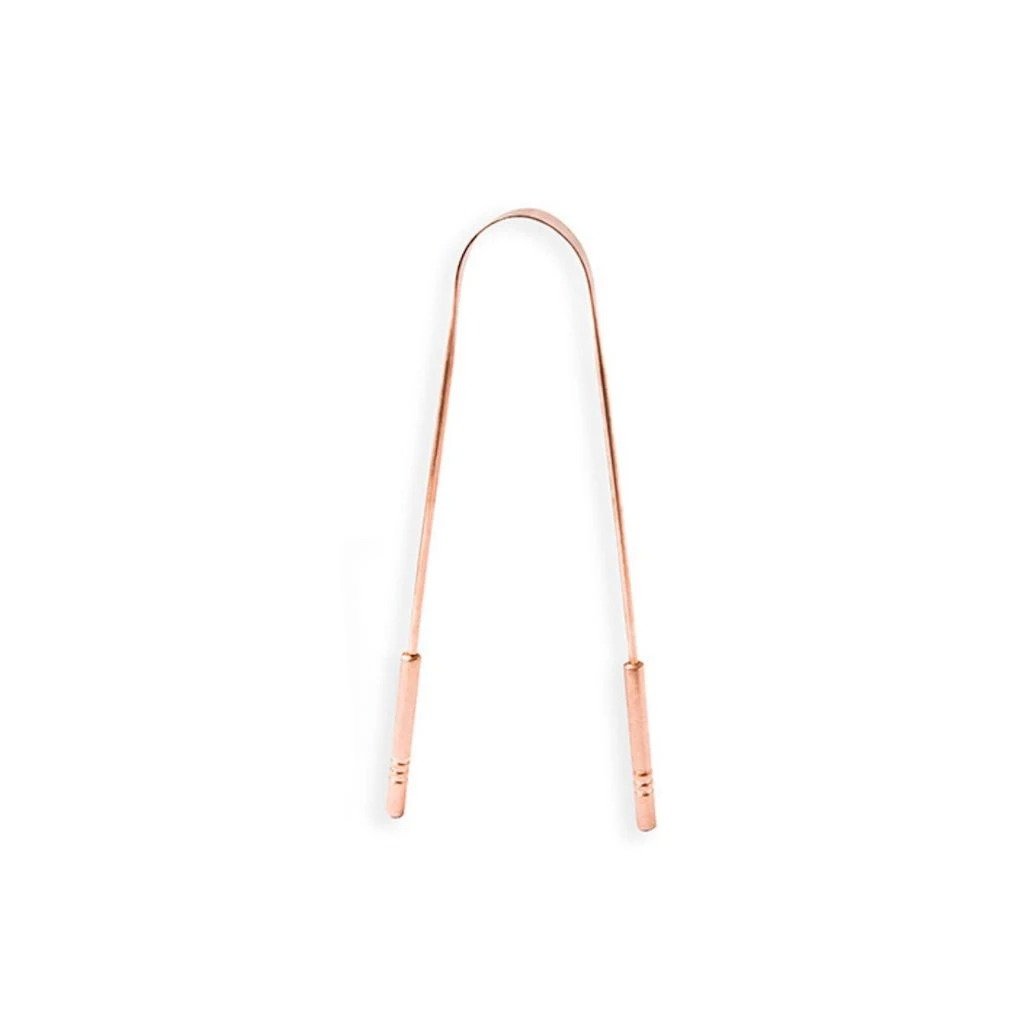 Seed & Sprout in rose gold tongue scraper with curved u-shaped design and ridged handles.